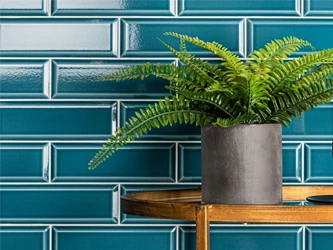 Subway blue tiles on a tiled wall in brick effect style