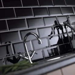 Metro black gloss tiles on a wall in brick style