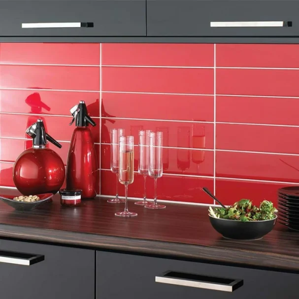 subway red wall tile in 100x300 tiled on a kitchen splash back gloss finish.