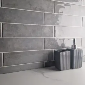 nebula rustic grey glossy ceramic wall tile on a splash back in brick style 75x300mm