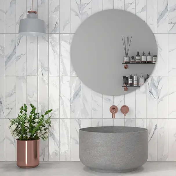 marble grey subway tiles in 75x300mm on a bathroom wall in soldier style.