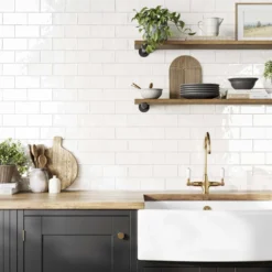 image of handcrafted white wall tile on a kitchen splashback in 75x150mm